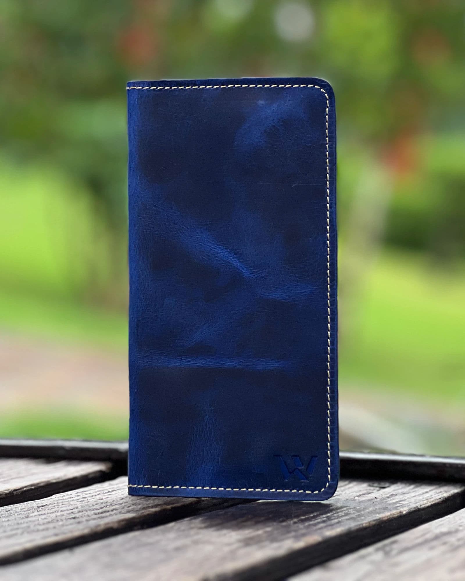 Blue genuine leather long wallet for men with cream contrast stitching and embossed W logo by Wrenza