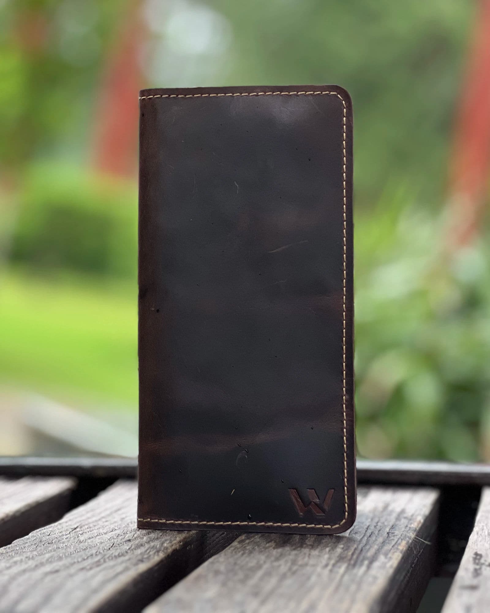 Dark brown leather long wallet for men with zip pocket, phone holder and cream stitching by Wrenza