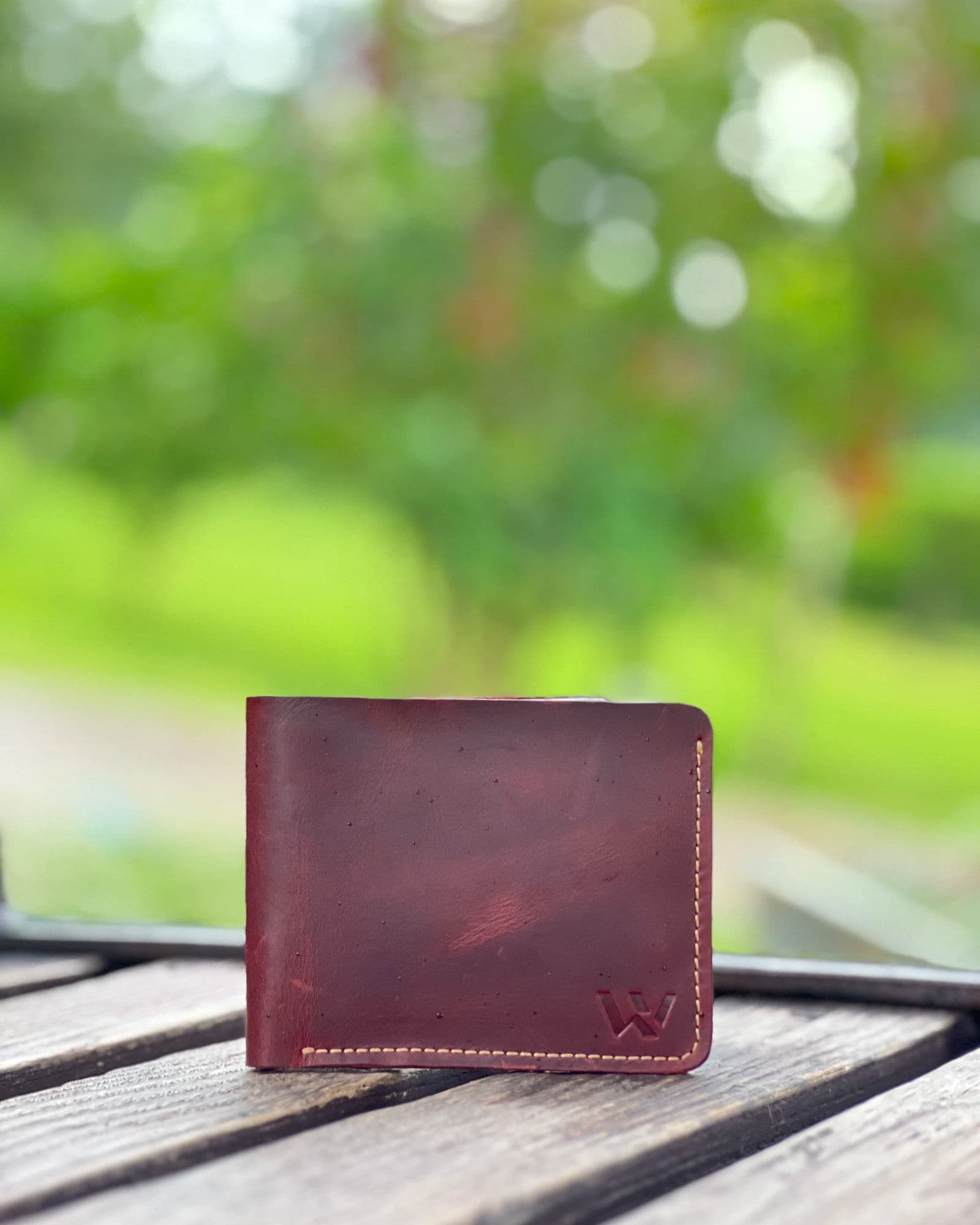 Maroon classic leather bifold wallet for men with black interior and cream stitching by Wrenza