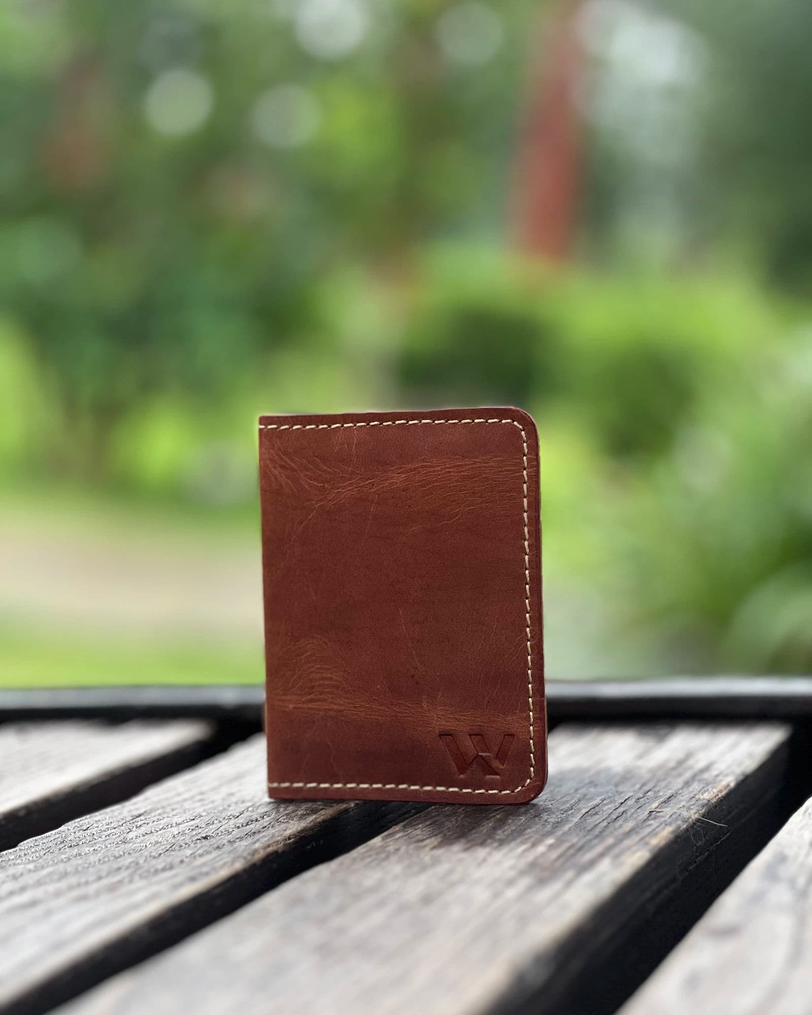 Tan compact leather card holder for men with cream stitching and embossed W logo by Wrenza