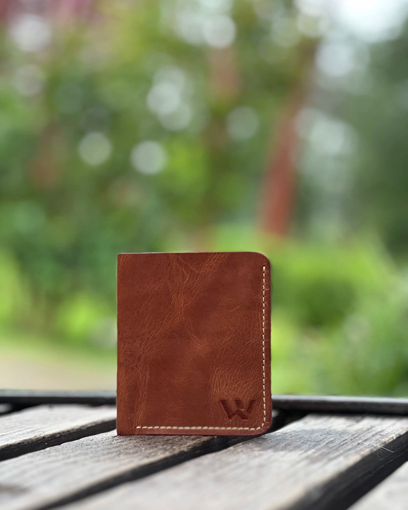 Tan leather card holder for men with cream stitching and embossed W logo by Wrenza
