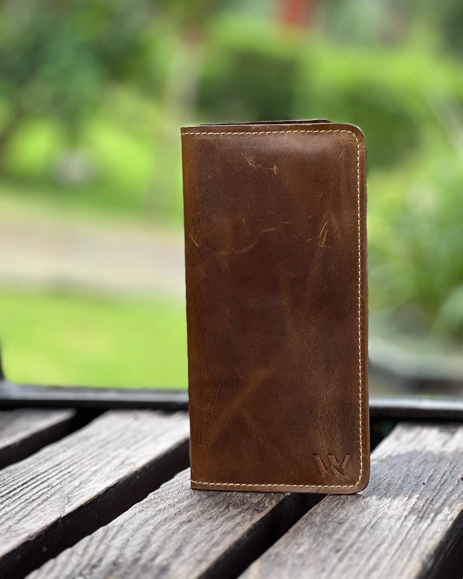 Tan leather long wallet for men with zip pocket, phone holder and cream stitching by Wrenza